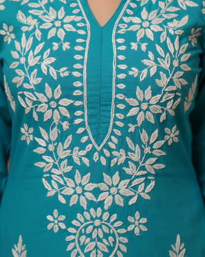 Turquoise Blue Rayon Kurti With White Embroidery.
